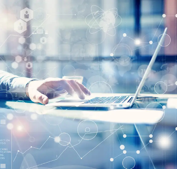 A person uses a laptop at a desk, with digital graphics and data visualization overlays representing technology, PLM, Digital Thread, and data analysis.